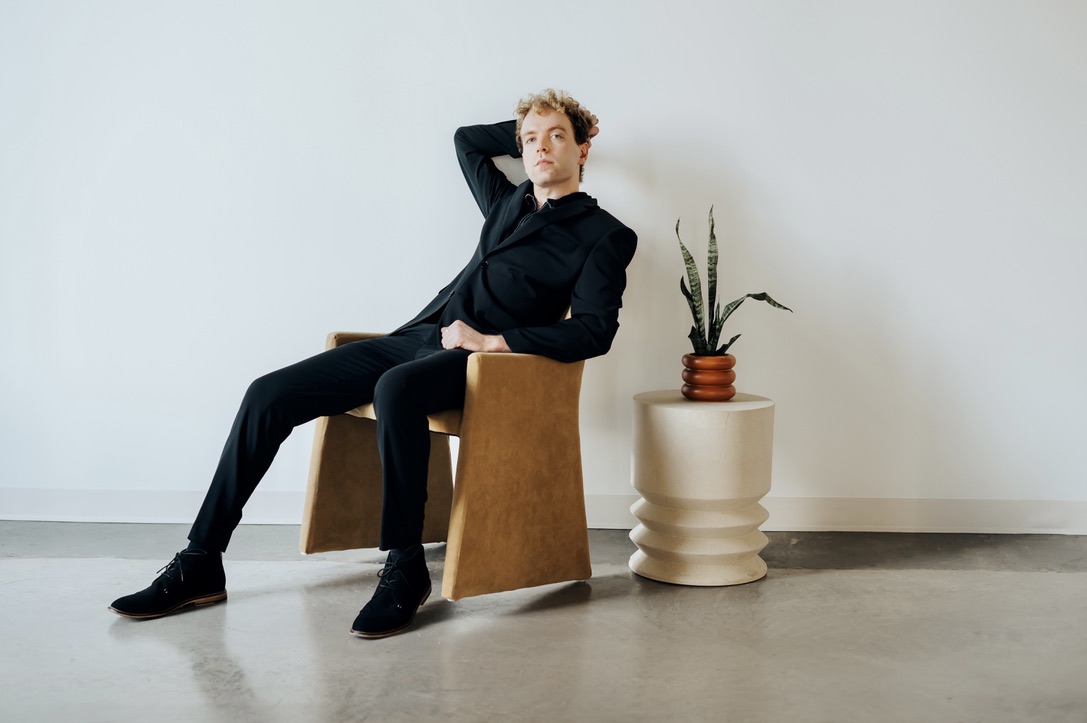 Jordan sitting in a modern chair